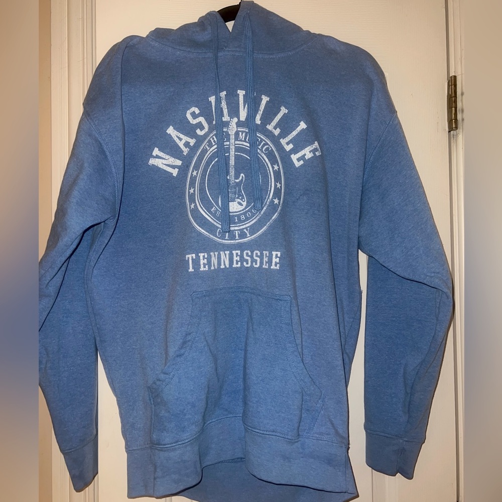 Light blue sweat shirt hoodie with NASHVILLE Tennessee (the Music City)